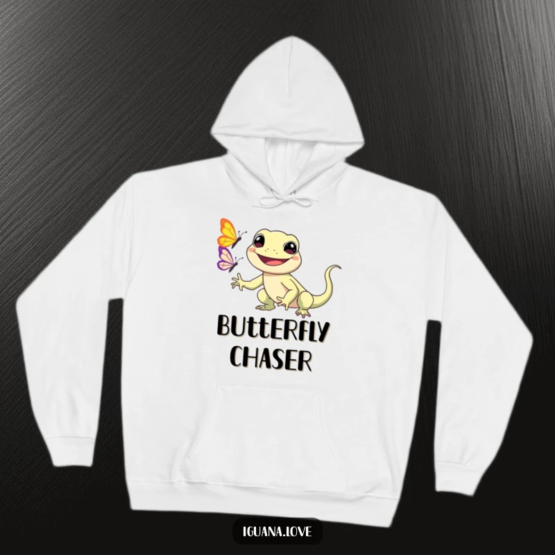 Funny Kawaii Iguana Hoodie features a smiling iguana character happily chasing a butterfly, providing warmth and undeniable cuteness.