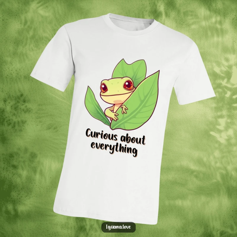 Funny t-shirt of a stylized iguana with a cheerful expression peeking from behind a large, vibrant leaf, highlighting curiosity.